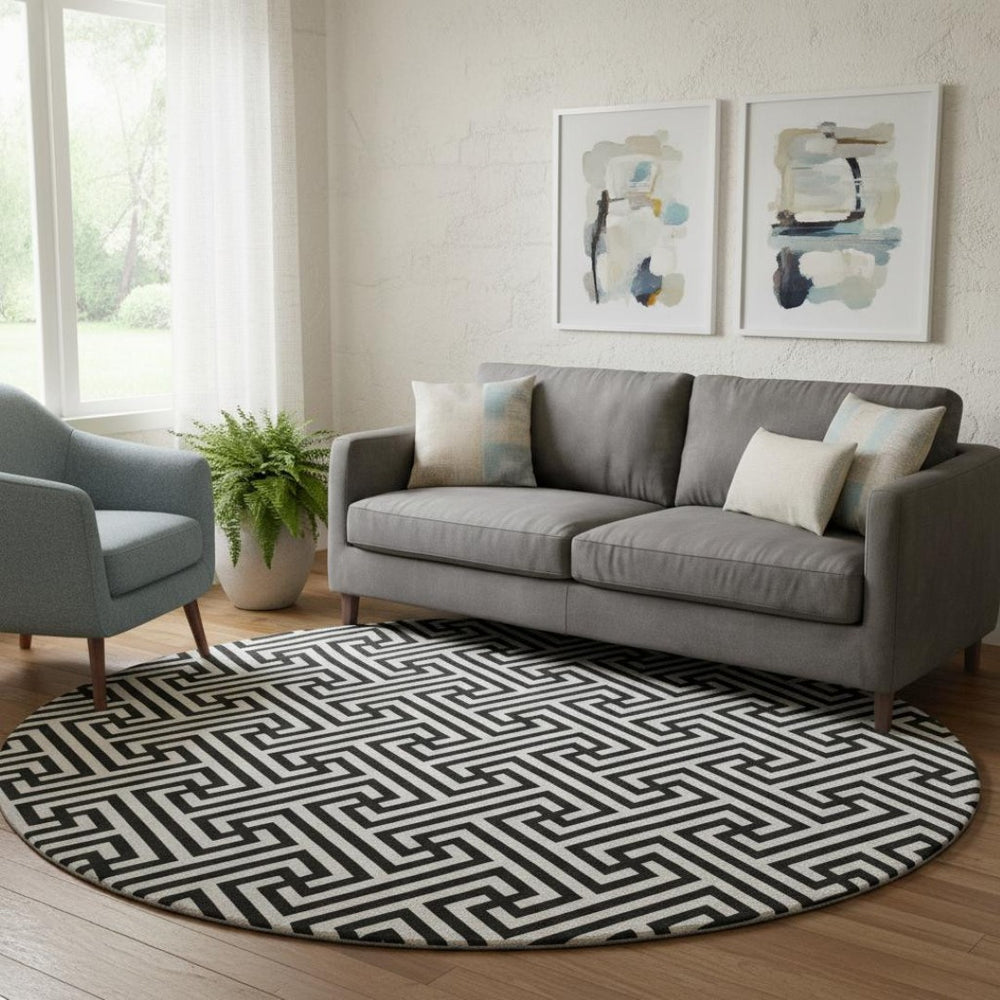 HomeRoots 8' Black And Ivory Geometric Round Rug - Washable, UV Protected, Durable, Ideal for Family Spaces 661782