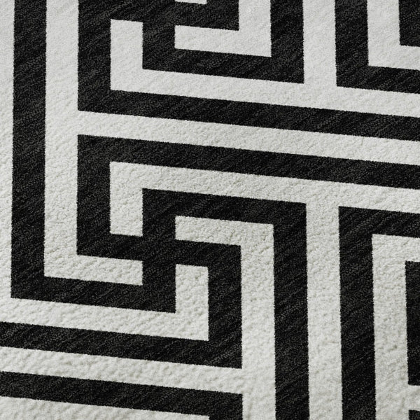 HomeRoots 8' X 10' Black and Ivory Geometric Area Rug – Washable, UV Protected, Stylish for Family Spaces 661783