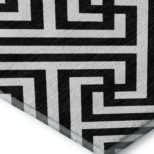 HomeRoots 8' X 10' Black and Ivory Geometric Area Rug – Washable, UV Protected, Stylish for Family Spaces 661783