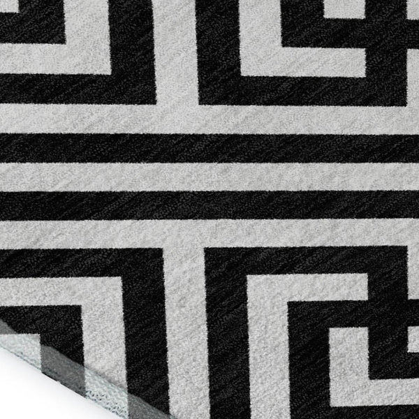 HomeRoots 9' X 12' Black And Ivory Geometric Washable Area Rug with UV Protection for Busy Family Homes 661784