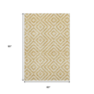 HomeRoots 5' X 8' Gold and Ivory Geometric Area Rug - Stylish, Washable, UV Protected for High Traffic Spaces 661925