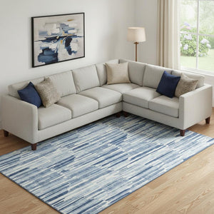 HomeRoots 9' X 12' Blue and Ivory Abstract Area Rug – Washable, Durable, UV-Protected for High-Traffic Spaces 662288