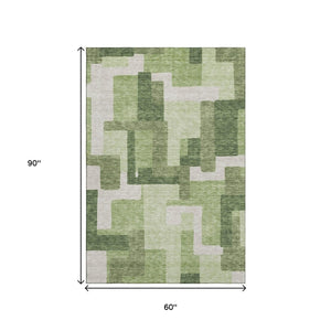 HomeRoots 5' X 8' Green and Ivory Abstract Geometric Area Rug - Washable, UV Protected, Stylish & Durable! 662437