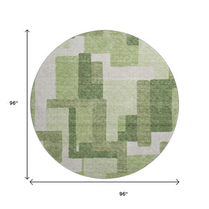 HomeRoots 8' Green and Ivory Abstract Geometric Washable Round Rug with UV Protection for Stylish Spaces 662438
