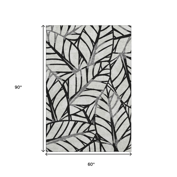 HomeRoots 5' X 8' Black & Beige Floral Area Rug - Washable, UV Protected, Stain Resistant for Easy Care 662479