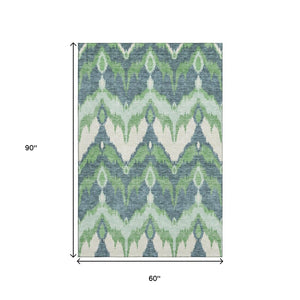 HomeRoots 5' X 8' Ikat Area Rug in Green and Ivory - Washable, Stain Resistant, UV Protected for Modern Spaces 662647