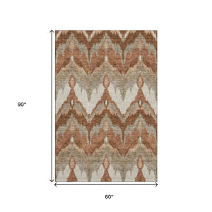 HomeRoots 5' X 8' Stylish Rust and Beige Ikat Area Rug - Washable, UV-Protected, Perfect for Family Homes! 662659