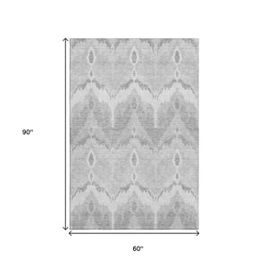 HomeRoots 5' X 8' Silver and Gray Ikat Area Rug – Stylish, Washable, UV-Protected, Stain-Resistant Design for Homes 662671
