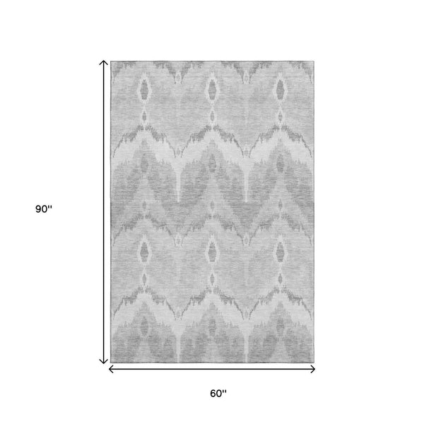HomeRoots 5' X 8' Silver and Gray Ikat Area Rug – Stylish, Washable, UV-Protected, Stain-Resistant Design for Homes 662671