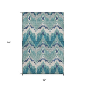 HomeRoots 5' X 8' Teal Ikat Area Rug - Washable, UV-Resistant, Stain-Repellent, Ideal for High-Traffic Spaces 662677