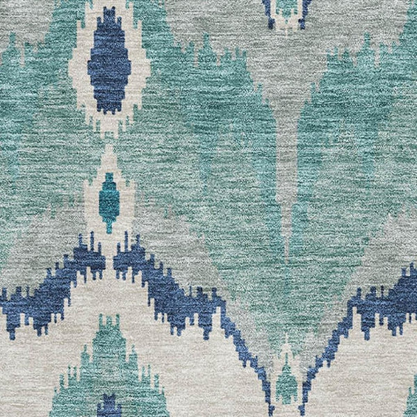 HomeRoots 8' X 10' Teal and Ivory Ikat Washable Area Rug with UV Protection for Stylish, High-Traffic Spaces 662679
