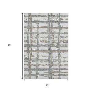 HomeRoots 5' X 8' Stylish Silver Ivory and Gray Striped Washable Area Rug with UV Protection for Your Home 662803