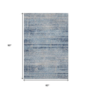 HomeRoots 5' Sky Blue and Gray Abstract Area Rug – Washable, UV Protected, Durable Design for Modern Homes 662953
