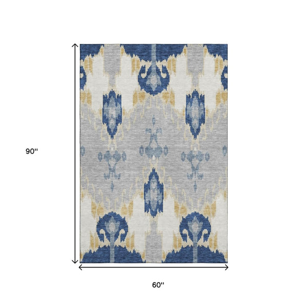 HomeRoots 5' X 8' Stylish Ikat Area Rug in Navy, Gold & Ivory - Washable, UV-Protected & Stain-Resistant Design 663001
