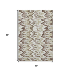 HomeRoots 5' X 8' Abstract Washable Area Rug in Beige, Ivory & Taupe - UV Protected, Ideal for Active Homes! 663115