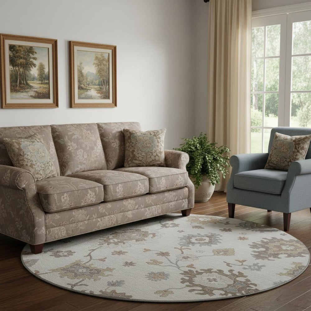 HomeRoots 8' Ivory Gray And Brown Floral Medallion Washable Round Rug with UV Protection for High-Traffic Spaces 663290