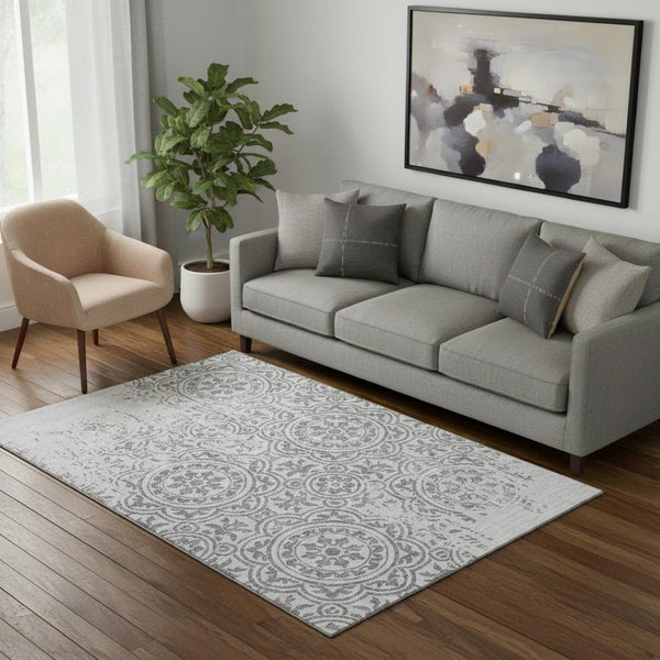 HomeRoots 5' X 8' Silver and Gray Medallion Area Rug - Washable, UV Protected, Durable for High-Traffic Spaces 663709