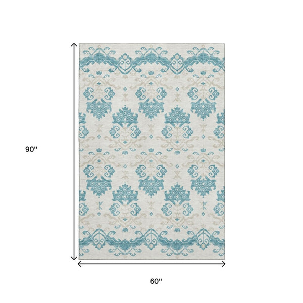 HomeRoots 5' X 8' Medallion Washable Area Rug in Teal, Ivory & Gray - Durable, UV Protected, Easy Care Design 663794