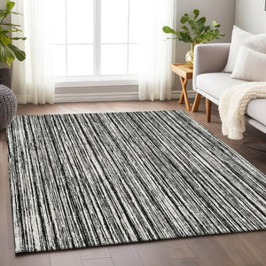 HomeRoots 5' X 8' Black And Ivory Striped Washable Area Rug - Durable, UV Protected, Perfect for High Traffic Homes 663800