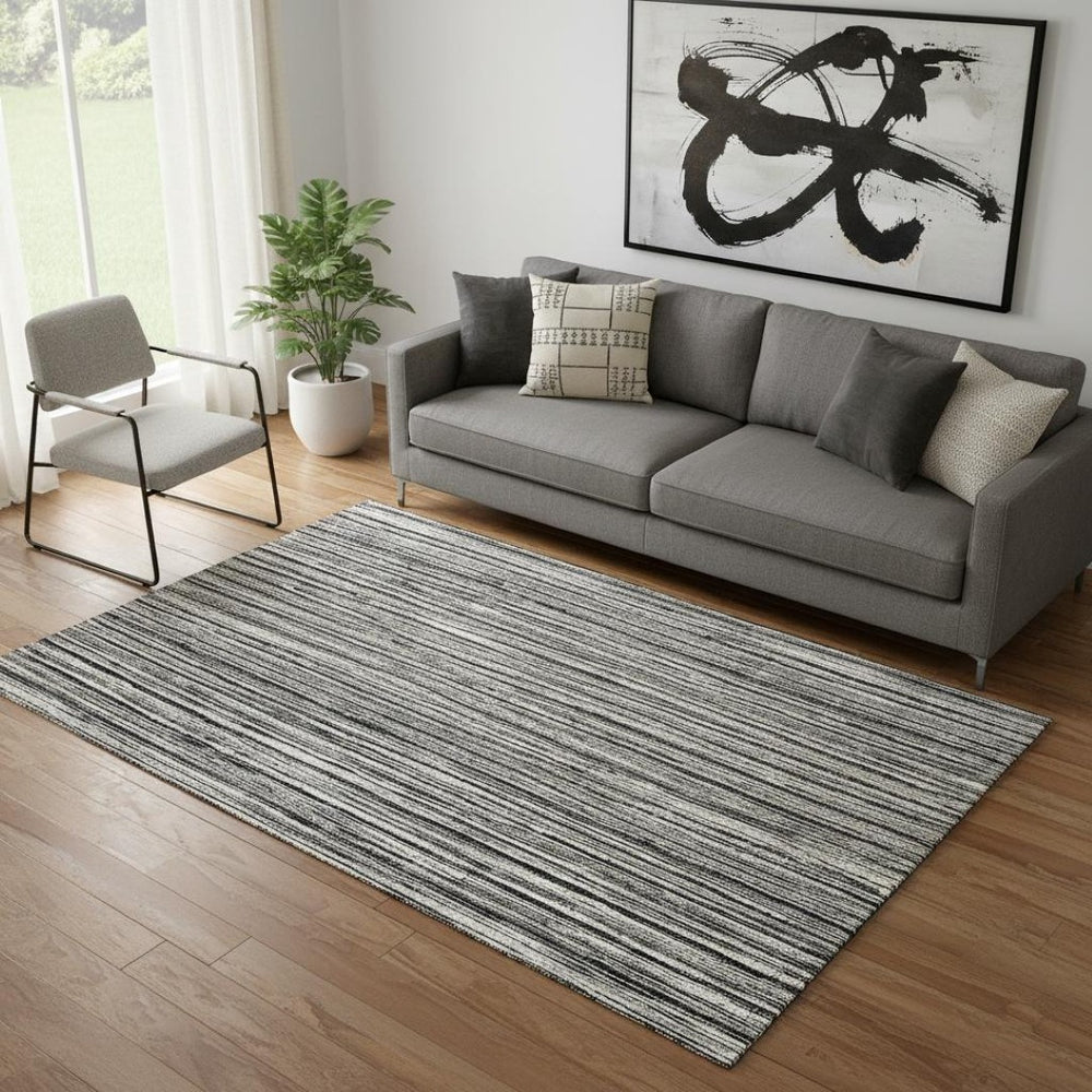 HomeRoots 5' X 8' Black And Ivory Striped Washable Area Rug - Durable, UV Protected, Perfect for High Traffic Homes 663800