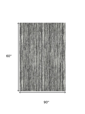 HomeRoots 5' X 8' Black And Ivory Striped Washable Area Rug - Durable, UV Protected, Perfect for High Traffic Homes 663800