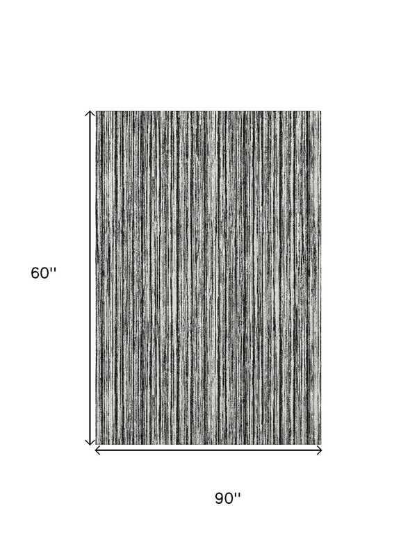 HomeRoots 5' X 8' Black And Ivory Striped Washable Area Rug - Durable, UV Protected, Perfect for High Traffic Homes 663800