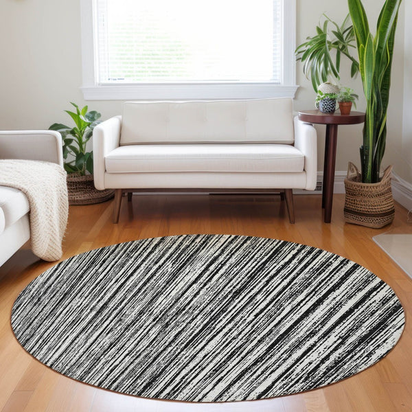 HomeRoots 8' Black And Ivory Striped Round Rug - Washable, UV-Protected, Durable for Homes with Kids & Pets 663801