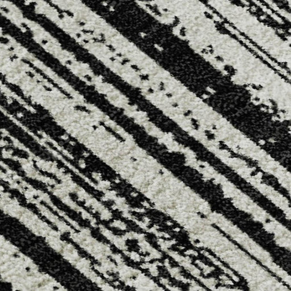 HomeRoots 8' X 10' Black and Ivory Striped Washable Area Rug with UV Protection for Stylish, Easy Living Spaces 663802