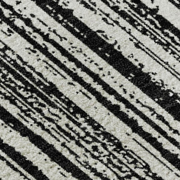 HomeRoots 8' X 10' Black and Ivory Striped Washable Area Rug with UV Protection for Stylish, Easy Living Spaces 663802
