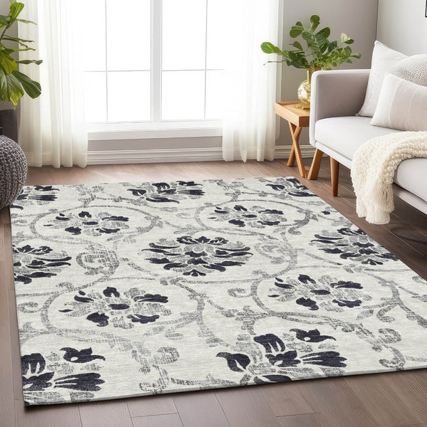 HomeRoots 5' X 8' Black And Ivory Floral Area Rug - Durable, Washable, UV-Protected for Style & Comfort 663944