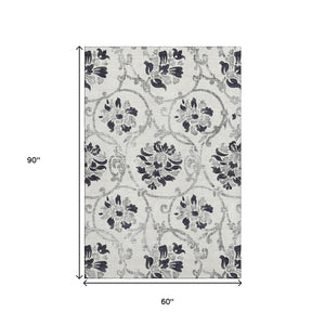 HomeRoots 5' X 8' Black And Ivory Floral Area Rug - Durable, Washable, UV-Protected for Style & Comfort 663944
