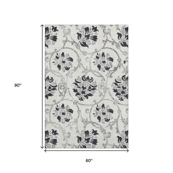 HomeRoots 5' X 8' Black And Ivory Floral Area Rug - Durable, Washable, UV-Protected for Style & Comfort 663944