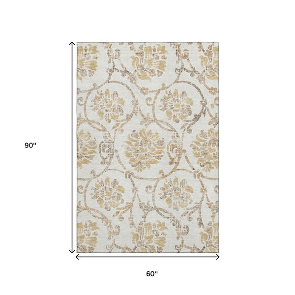 HomeRoots 5' X 8' Ivory Beige and Gold Floral Area Rug - Washable, UV-Protected, Perfect for High Traffic Areas! 663974