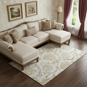 HomeRoots 9' X 12' Ivory Beige and Gold Floral Washable Area Rug with UV Protection for Family-Friendly Style 663977