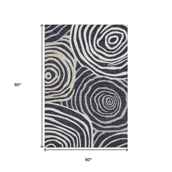 HomeRoots 5' X 8' Modern Black Ivory and Gray Abstract Area Rug - Washable, Durable, UV-Protected Design for Homes 664166
