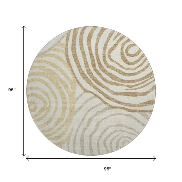 HomeRoots 8' Gold Ivory and Brown Abstract Round Rug - Washable, UV Protected, Perfect for Modern Spaces! 664191