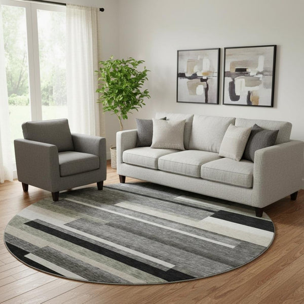 HomeRoots 8' Black Gray and Ivory Striped Washable Round Rug - Durable, UV-Protected, Ideal for Kids & Pets 664245