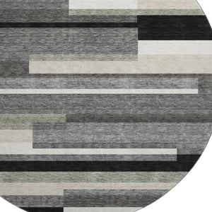 HomeRoots 8' Black Gray and Ivory Striped Washable Round Rug - Durable, UV-Protected, Ideal for Kids & Pets 664245