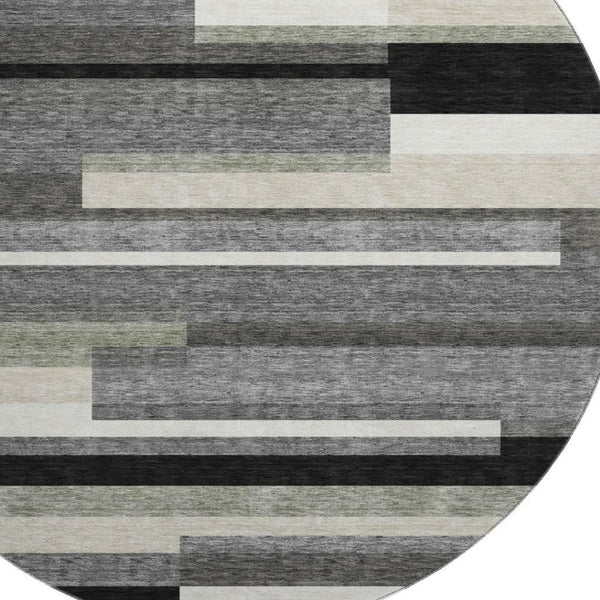 HomeRoots 8' Black Gray and Ivory Striped Washable Round Rug - Durable, UV-Protected, Ideal for Kids & Pets 664245