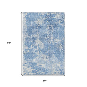 HomeRoots 5' X 8' Blue And Ivory Abstract Washable Area Rug - Stylish, Durable, UV-Protected for Every Space 664466