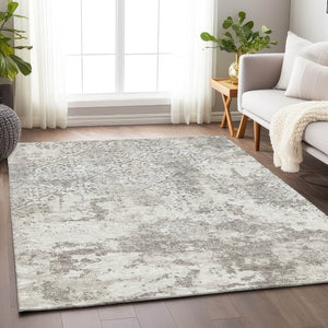 HomeRoots 10' X 14' Ivory and Gray Abstract Area Rug - Washable, UV Protected, Ideal for Modern Living Spaces 664506