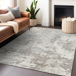 HomeRoots 10' X 14' Ivory and Gray Abstract Area Rug - Washable, UV Protected, Ideal for Modern Living Spaces 664506