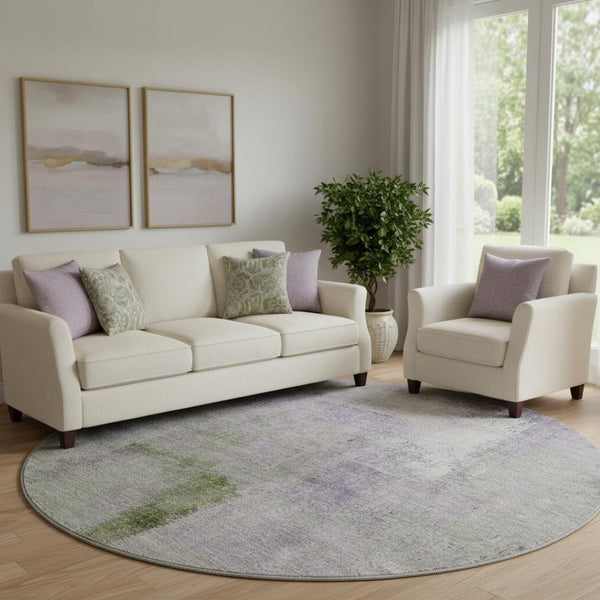 HomeRoots 8' Modern Abstract Round Rug in Purple, Ivory & Green - Washable, UV Protected & Stain Resistant! 665287