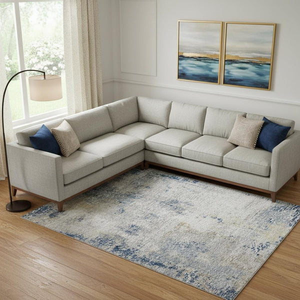 HomeRoots 9' X 12' Abstract Washable Area Rug in Blue, Taupe & Ivory - UV Protected, Durable & Stylish Design 666226