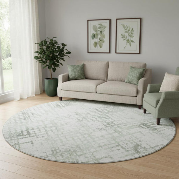 HomeRoots 8' Green and Ivory Abstract Geometric Round Rug - Washable, UV-Protected, and Perfect for Any Space 666647