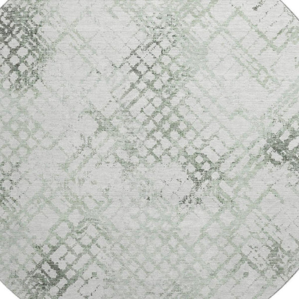 HomeRoots 8' Green and Ivory Abstract Geometric Round Rug - Washable, UV-Protected, and Perfect for Any Space 666647