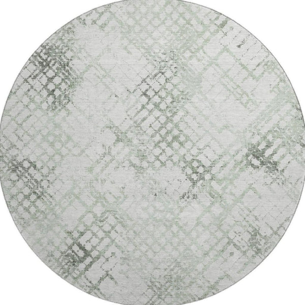 HomeRoots 8' Green and Ivory Abstract Geometric Round Rug - Washable, UV-Protected, and Perfect for Any Space 666647