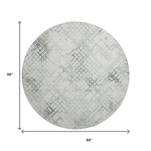 HomeRoots 8' Green and Ivory Abstract Geometric Round Rug - Washable, UV-Protected, and Perfect for Any Space 666647