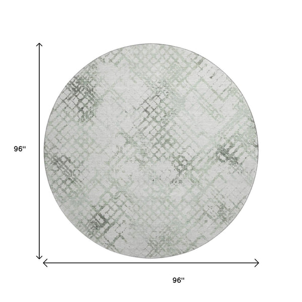 HomeRoots 8' Green and Ivory Abstract Geometric Round Rug - Washable, UV-Protected, and Perfect for Any Space 666647