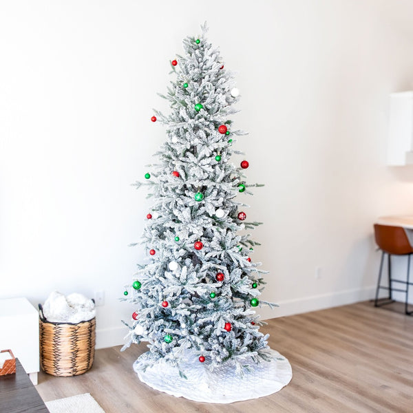 HomeRoots 8' Elegant Slender Flocked Pine Christmas Tree - Perfect for Compact Spaces with Realistic Snow Finish 666718
